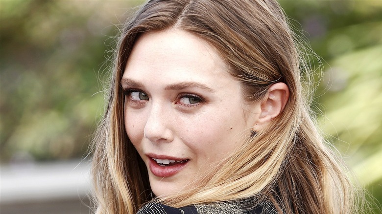 Elizabeth Olsen turning and smiling