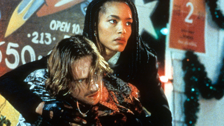 Angela Bassett holds Ralph Fiennes