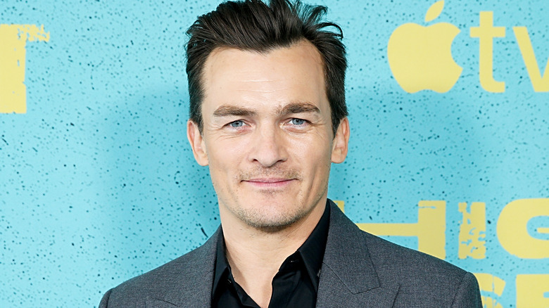 Rupert Friend smiling at premiere