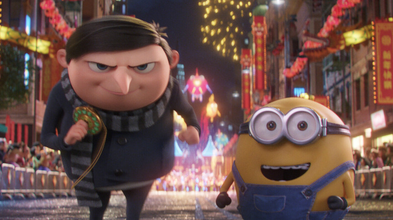 Gru racing with an amulet and Minion pal in Minions: The Rise of Gru (2022)