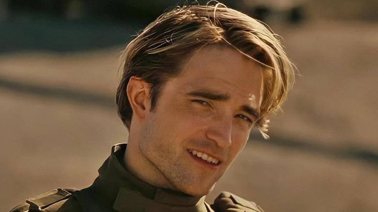 Robert Pattinson smiles in 
