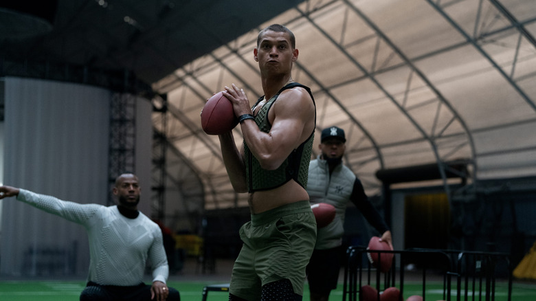 Cam throwing a ball while Isaiah watches in 