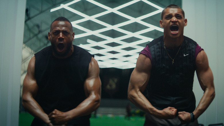 Isaiah White and Cameron Cade flexing while yelling