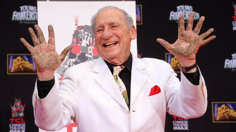 Mel Brooks showing hands