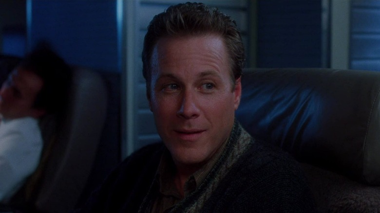 Peter McCallister smiling on plane