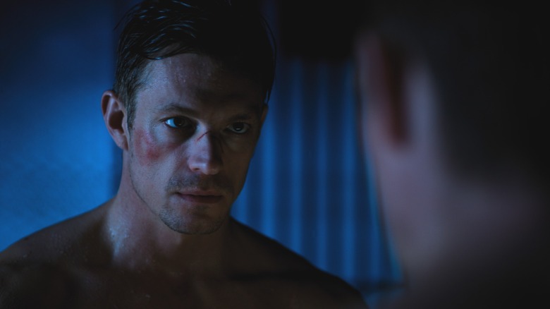 Takeshi Kovacs in Altered Carbon, looking at himself in the mirror