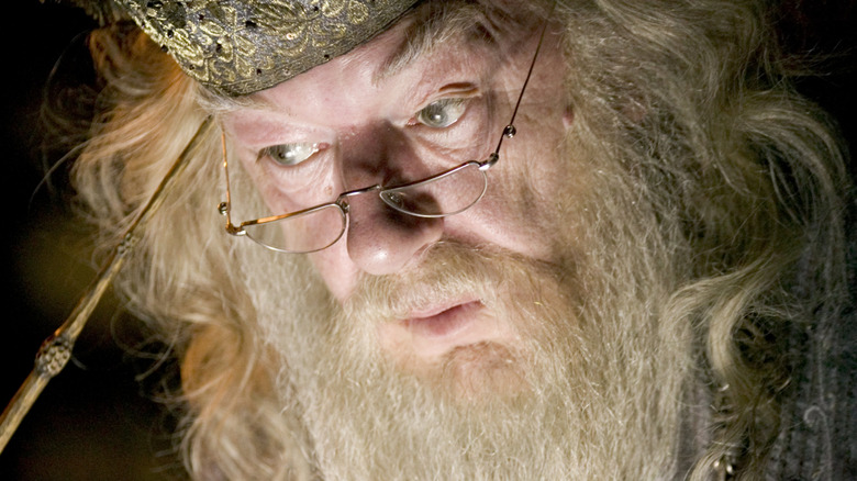 Dumbledore extracting memories with wand