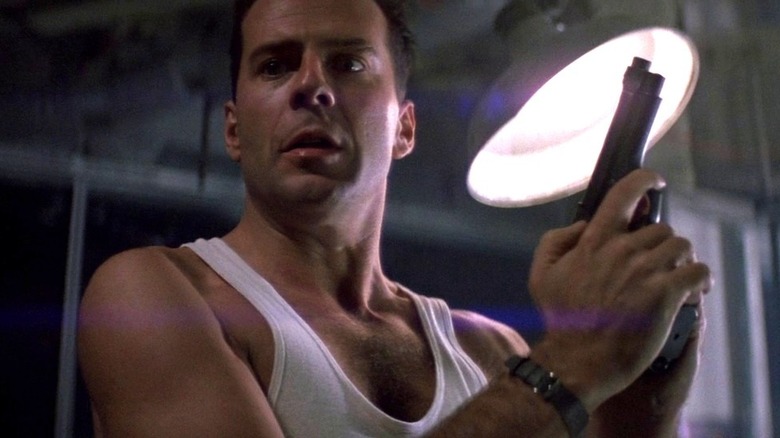 John McClane holding gun