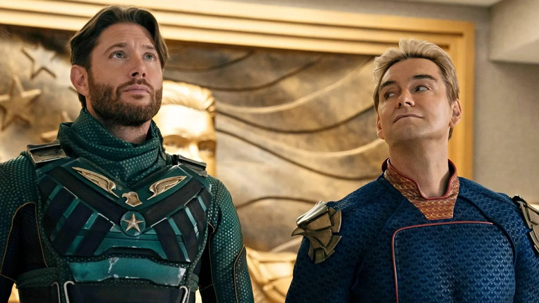 Soldier Boy and Homelander standing together in front of a golden panel depicting Homelander and the American flag