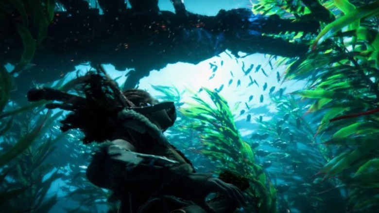 Aloy swimming below machine