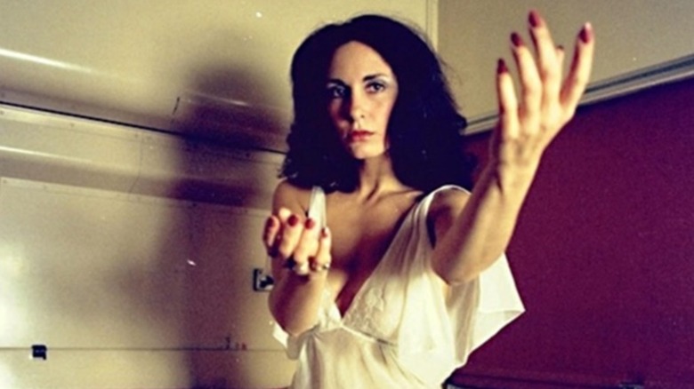 Abbie Santini beckons in "Martin"