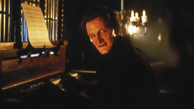 The Phantom plays the organ in a candlelit lair in "The Phantom of the Opera"