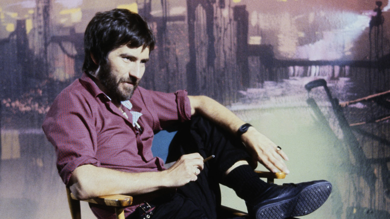 Tobe Hooper sitting in chair
