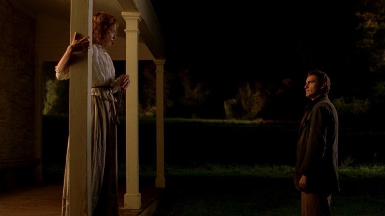 Ivy and Lucius talking on front porch