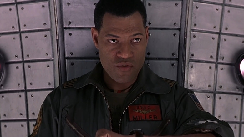 Captain Miller looking at his watch in Event Horizon (1997)