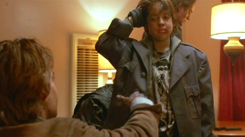 Joshua Miller holds a gun
