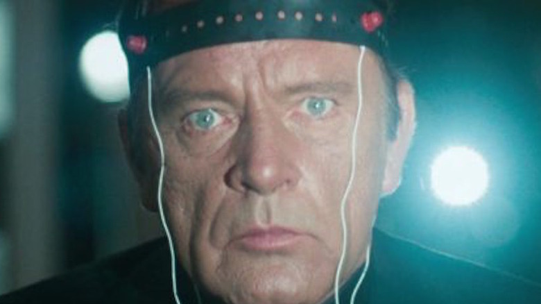 Richard Burton wears a headband