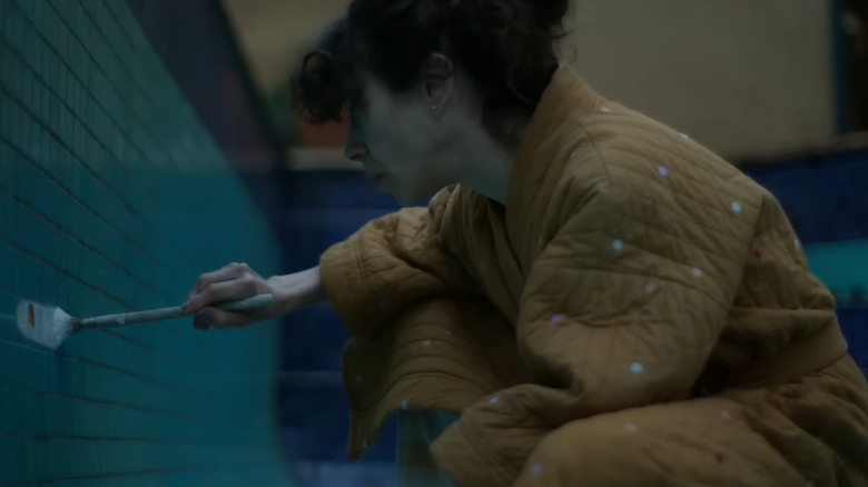 Woman paints swimming pool in "Bring Her Back" (2025)