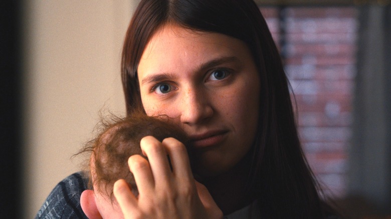 Leanne Grayson holds baby Jericho in 