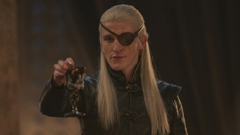 Aemond raising his glass to his Strong nephews