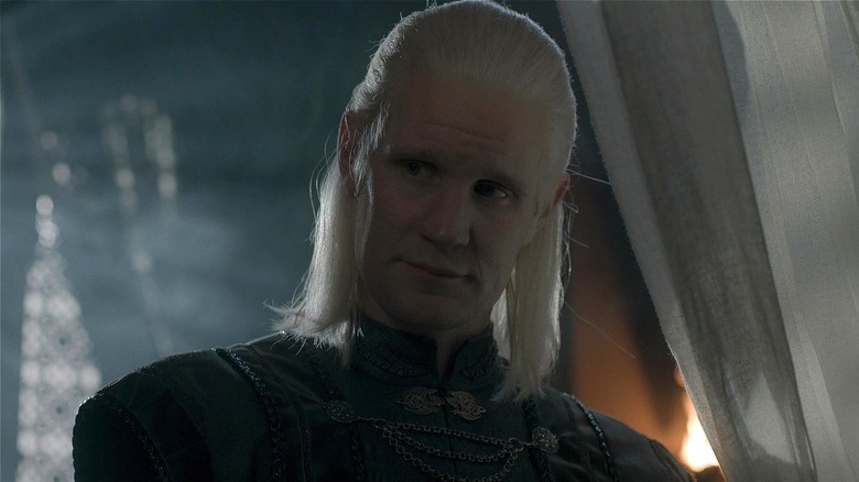 Prince Daemon tilting his head listening in 