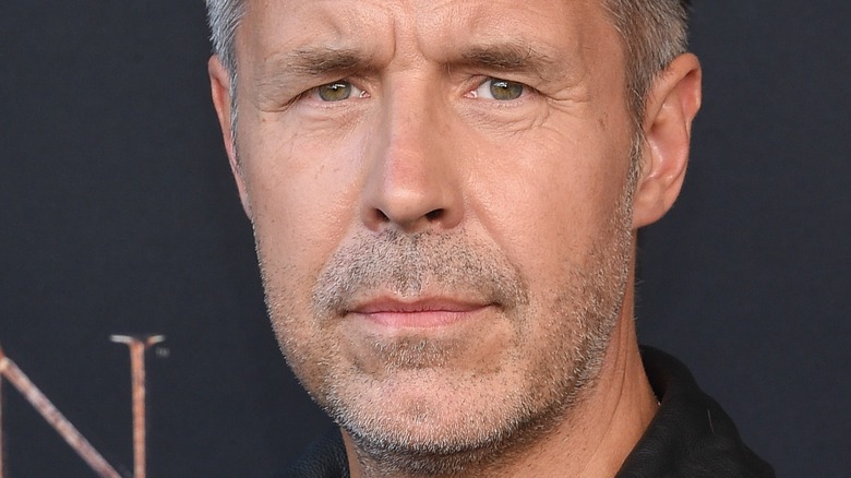 Paddy Considine posing on red carpet 