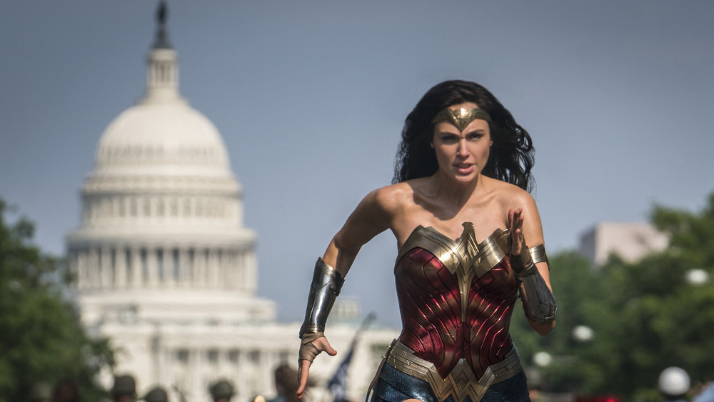 Gal Gadot running in front of the Washington DC Capitol Building in Wonder Woman 1984