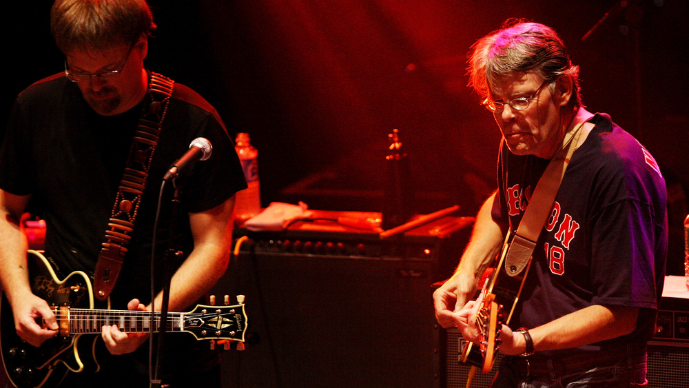 Stephen King plays guitar