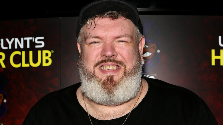 Kristian Nairn smiling outside club