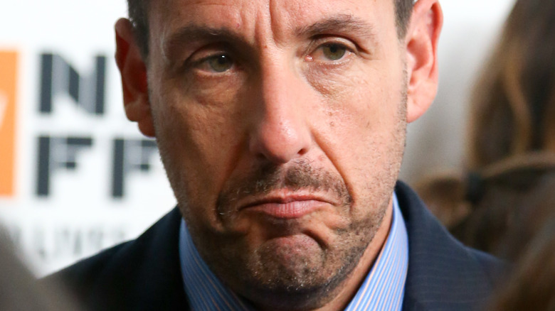 Adam Sandler frowning