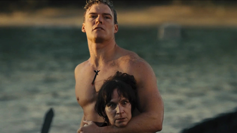 Gloss holding Wiress with an arrow in his chest in 