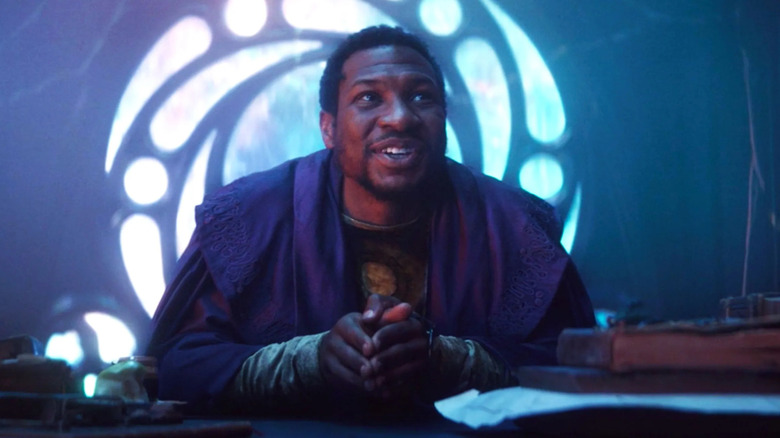 Jonathan Majors sitting as Kang in Loki