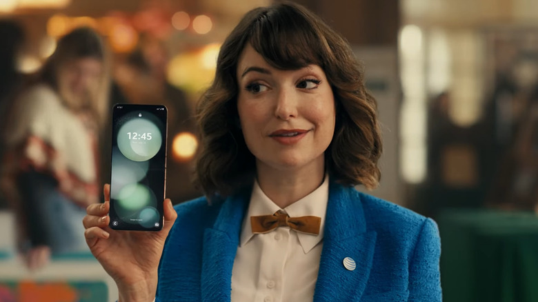 Lily from AT&T holding a smartphone