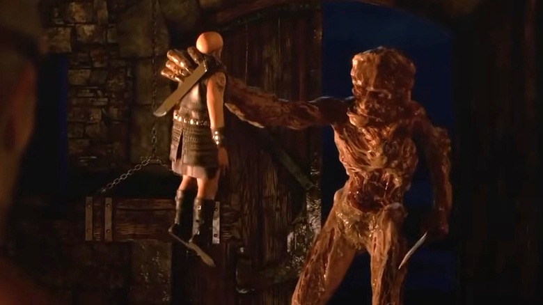 Grendel holds a warrior
