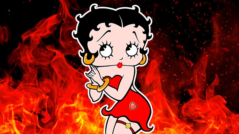 Betty Boop in front of red fire