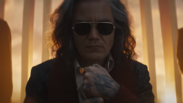 Michael Shannon with long grey hair and sunglasses