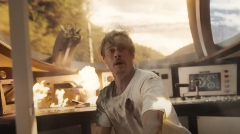 Brad Pitt inside a destroyed train conductor car