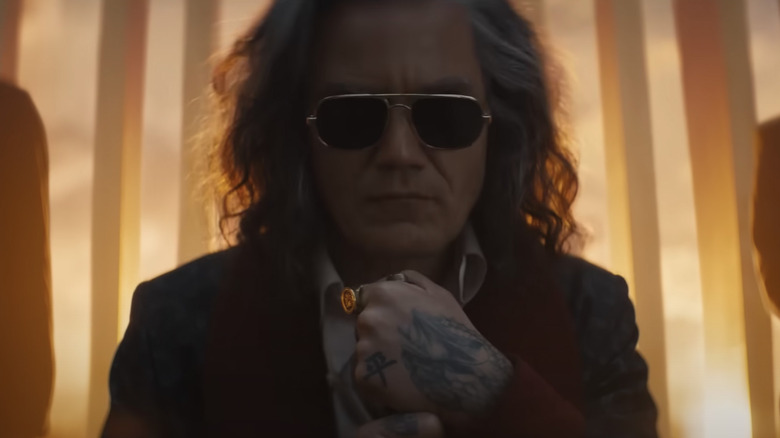Michael Shannon with long grey hair and sunglasses