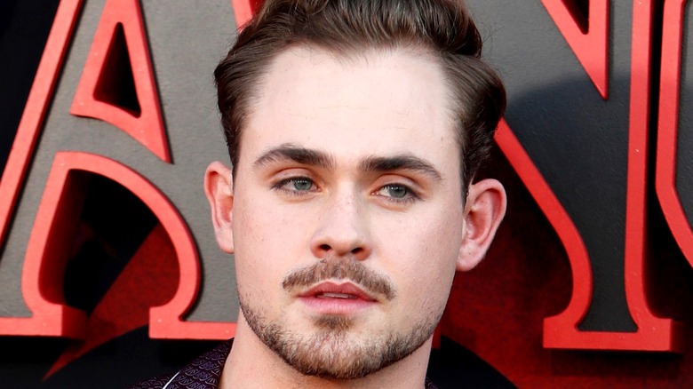 Dacre Montgomery posing at premiere