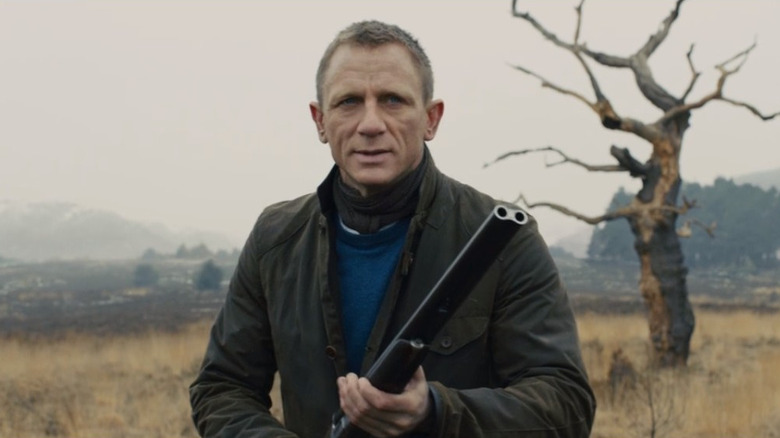 James Bond holding a shotgun