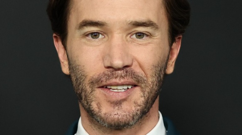 Tom Pelphrey posing for red-carpet photos