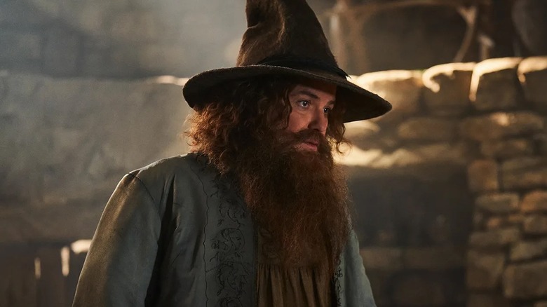 Bombadil in a pointy hat in his house in "The Rings of Power" (2022-present)