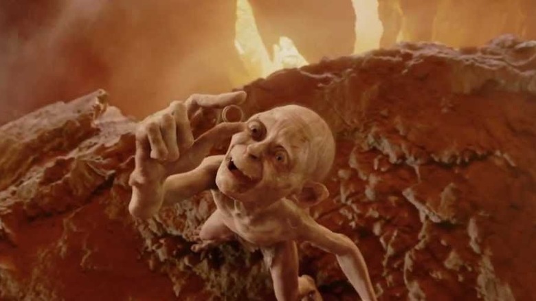 Gollum holds up the One Ring at the Cracks of Doom in "The Return of the King" (2003)
