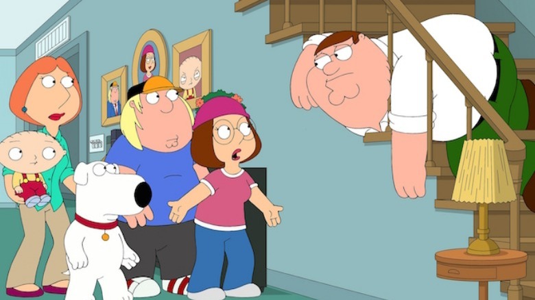 Peter Griffin with his head stuck in a railing