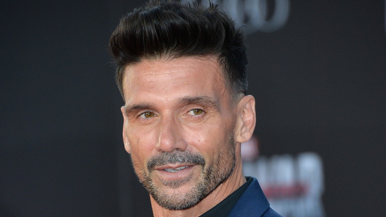 Frank Grillo wearing blue suit and black shirt