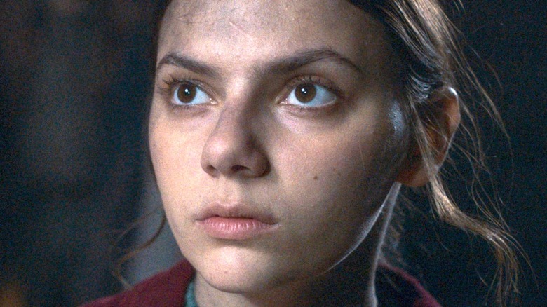 Dafne Keen as Lyra looking focused