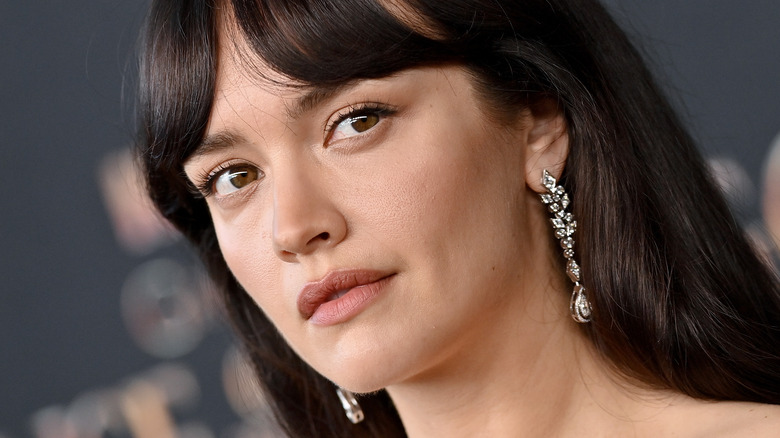 Olivia Cooke smiling on red carpet