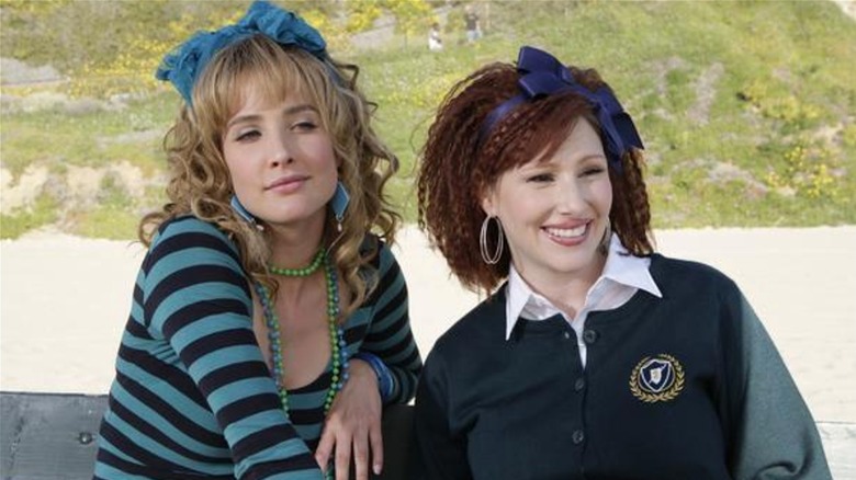 Robin Sparkles and Tiffany hanging out on a park bench on 