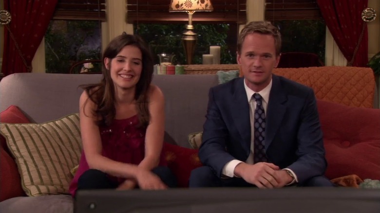 Robin and Barney on her couch on How I Met Your Mother