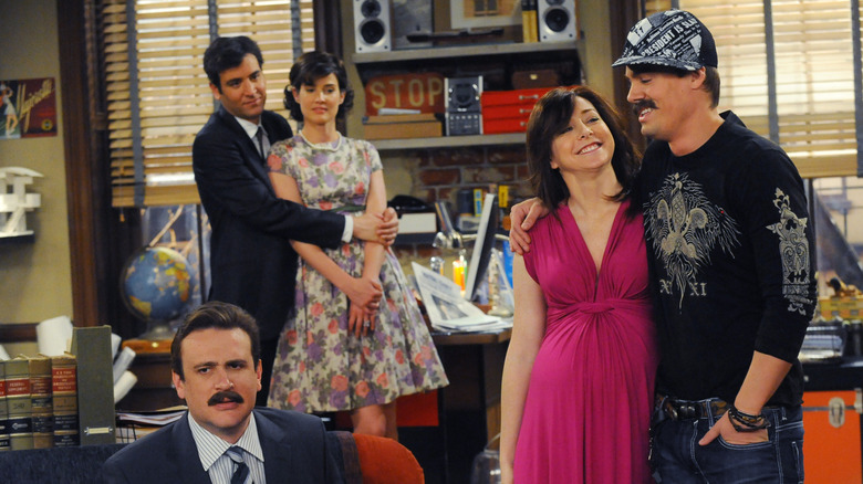 Ted and Robin and Lily with a stranger and Marshall on How I Met Your Mother
